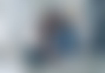 Self-employed seamstress working on her laptop