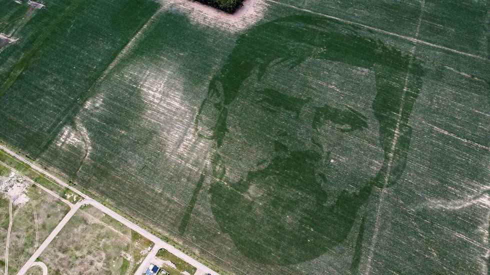 Lionel Messi's face revealed in a corn field.