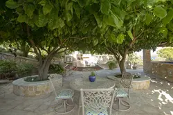 water's edge villa lefkada shaded garden seating