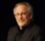 Steven Spielberg wearing a black shirt and black jacket