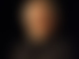 Steven Spielberg wearing a black shirt and black jacket