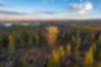 the Spruce Mountain Fire Lookout Tower during a glowing sunrise at Medicine Bow National Forest