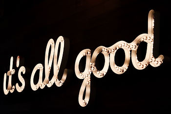 Neon sign saying: It's all good news!