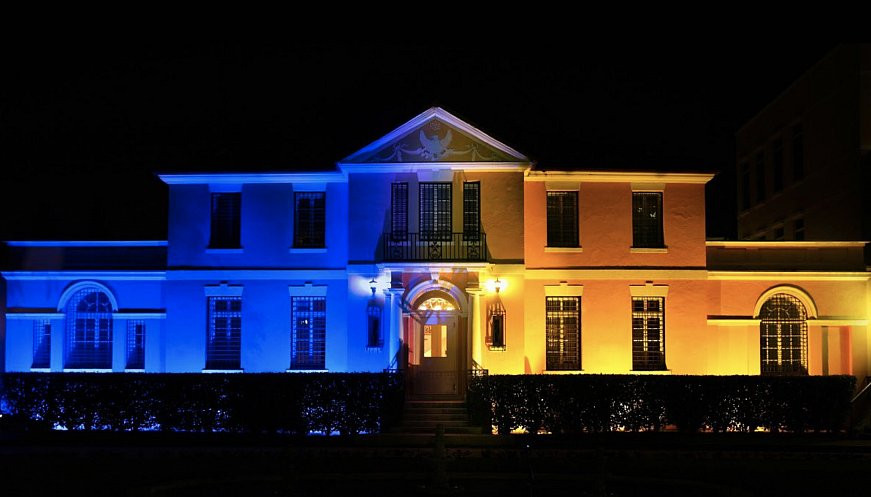 US Embassy in Tirana, Albania, lit up in the blue and yellow colours of Ukraine's flag