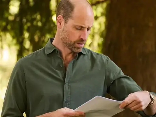 Prince William wearing a green shirt