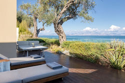 domes miramare corfu beach sunloungers