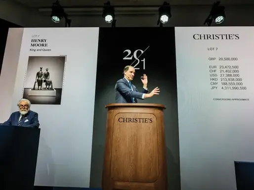 Christie's new oak rostrum, designed by Sir Jony Ive