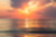 The sun setting across the ocean