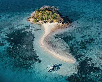 Tiny island with a canoe pulled up the beach