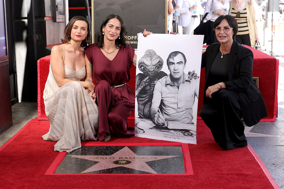 Carlo Rambaldi’s daughter and two granddaughters holding a photo of him on the Hollywood Walk of Fame