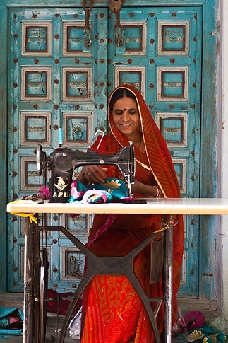 Woman working on creating artistry as example of art workshop content.