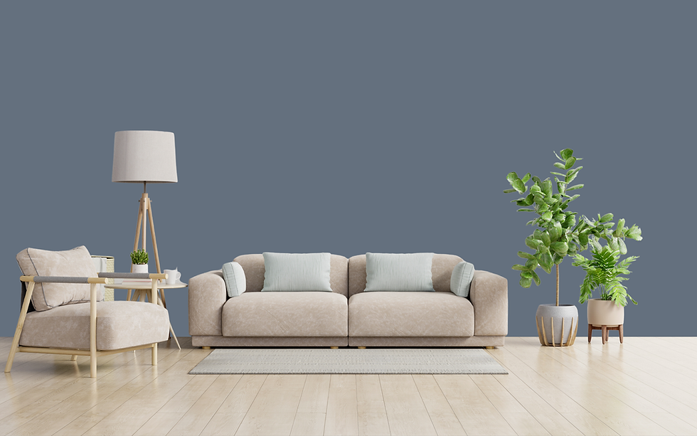 Beige sofa, blue wall, plant, and lamp in modern living room.