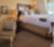 Barretts room bed, chair, side tables and artwork on wall