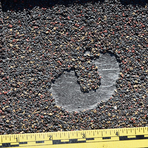 circular pattern on residential roof shingle
