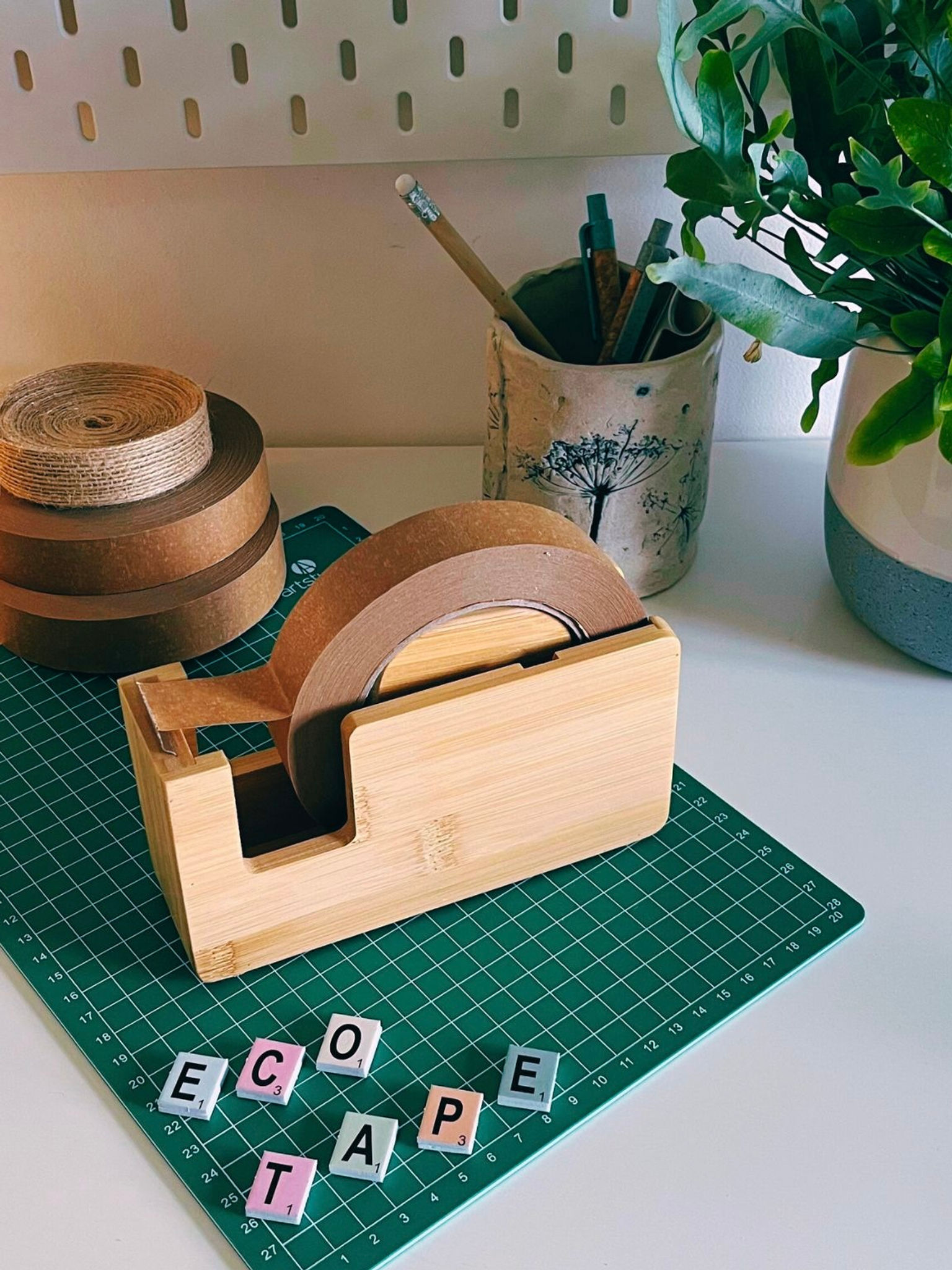 Sustainable bamboo tape dispenser for eco gift wrapping, office use, and plastic-free packaging. Ideal for paper tape