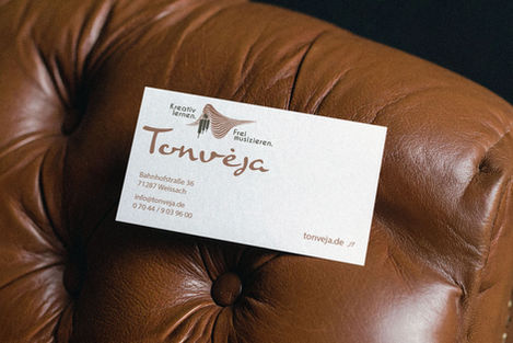 Leather chair with business card design music school
