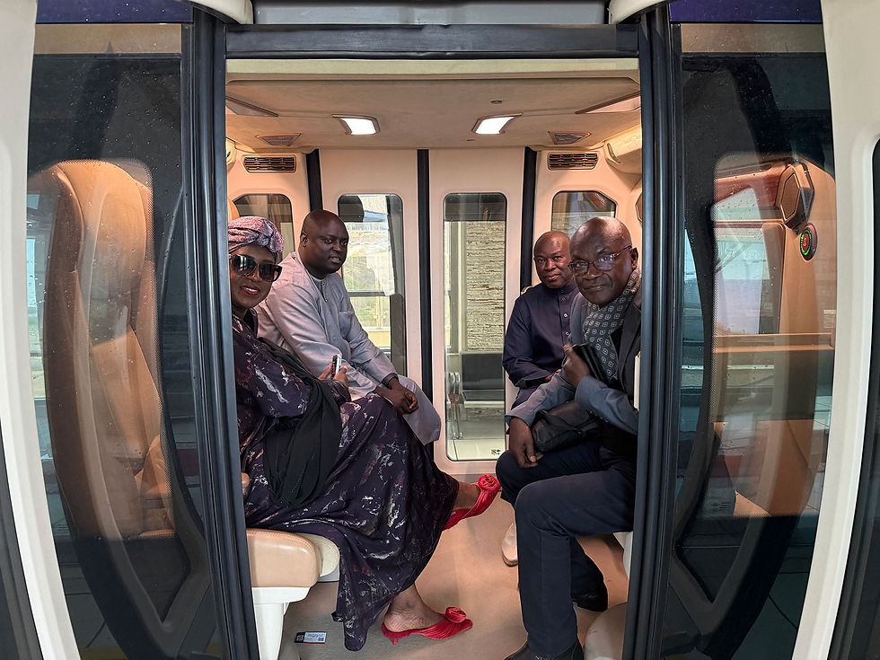 uSky Transport: Delegation guests enjoy the interactive experience of traveling on uCar