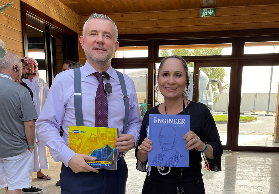 Mrs. Clediane Areco Matzenbacher Mayor of Jardim/MS with Dr. Anatoli Unitsky's book at uSky Transport office