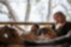 Couple relax and read at a lodge by a commercial photographer cape town