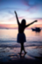 Woman silhouetted on beach by commercial photographer Cape Town.