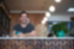 Smiling business owner benefiting from commercial photography services.