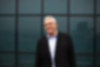 Professional portrait photography of a smiling senior man.
