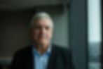 Senior man in professional portrait photography near a window