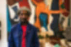 Man in a blue jacket posing for professional portrait photography.