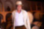 Man in a hat standing in a wine cellar in Cape Town