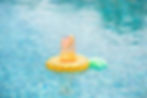 Iced cocktail with grapefruit in a pool floatie