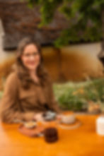 Woman at a table with professional portrait photography.
