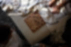Chess board on a cushioned ottoman between two people