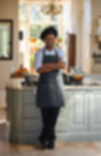 Smiling male chef in professional portrait photography