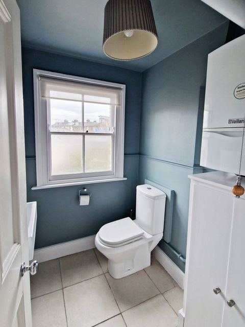 Interior painting of a bathroom blue grey