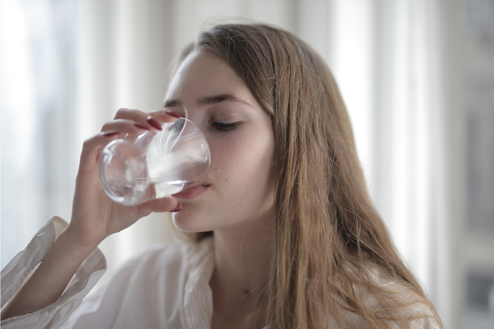 **Alt text (14 words):** *Woman drinking water, illustrating dry mouth and thirst caused by nighttime mouth breathing.