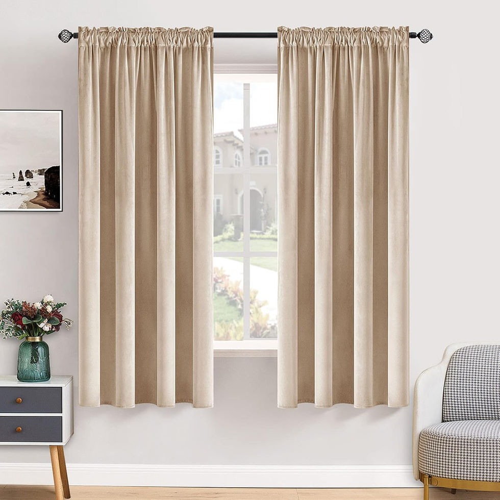 Beige curtains hanging in a room with a window view