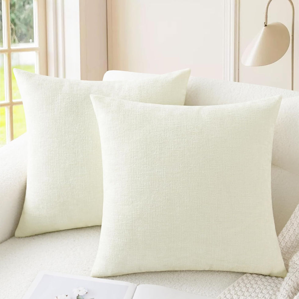 Two white cozy chenille cushion covers on a sofa.