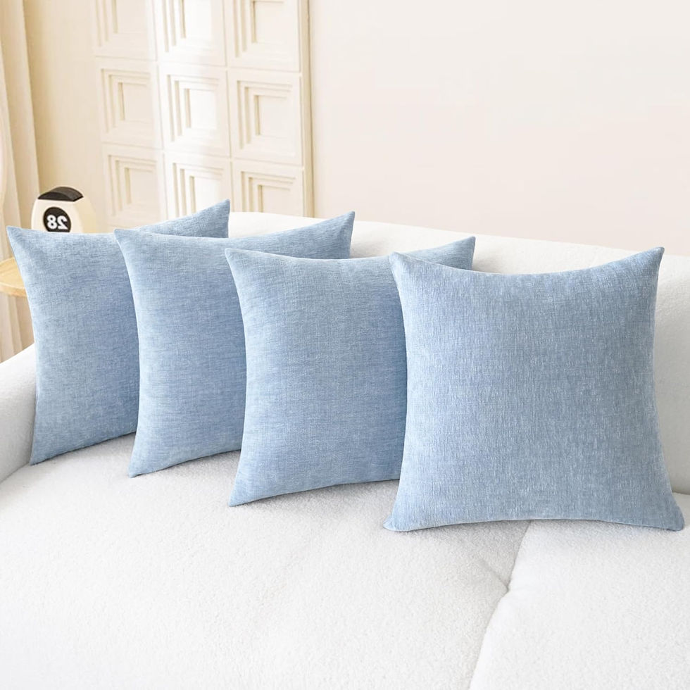 Four blue chenille throw pillow covers on a white sofa.
