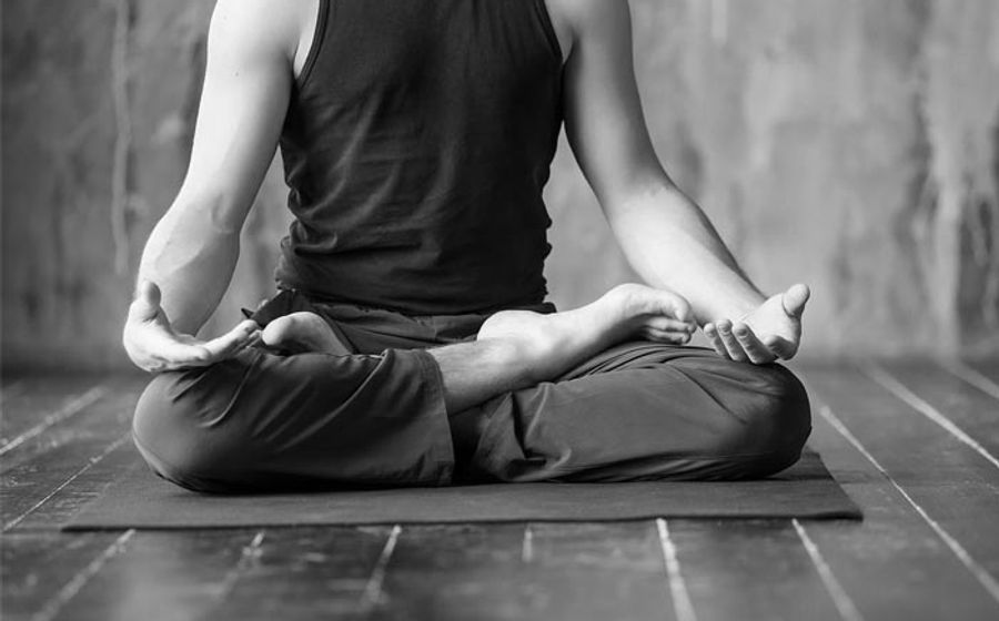 Man practising yoga and meditation