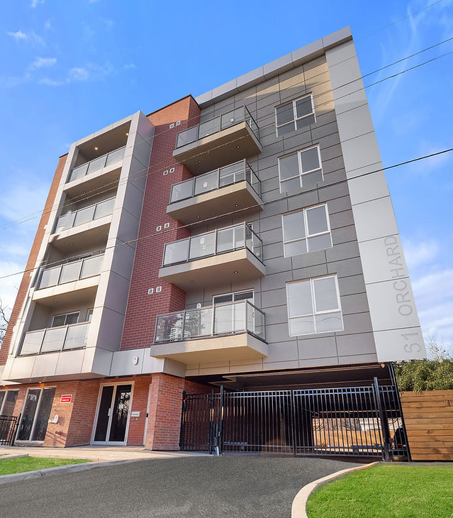 61 Orchard Park exterior beneath a blue sky