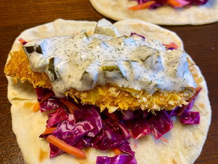 Coconut Chicken Tacos with Dill Tzatziki Sauce and Tangy Slaw