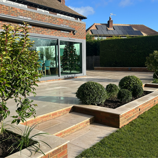 Egyptian limestone terrace with evergreen planting