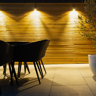 Outdoor dining space with Venetian fencing