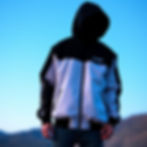 Split Shift brand Jacket that is half white and half black.jpg