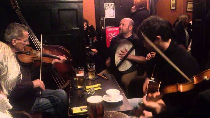 Musicians pack into Sandy Bell's for a traditional session of music every day!