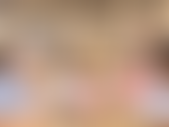 Image of families looking at animals in a petting zoo at the State Fair of Texas