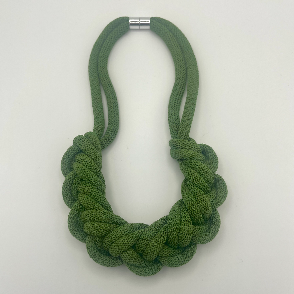Thumbnail: flat lay of fern green cotton rope necklace