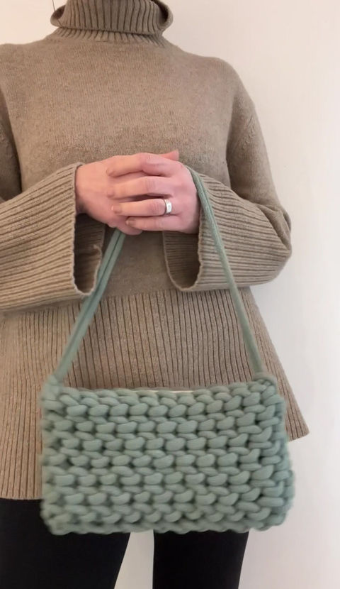 Thumbnail: video of person holding sage green short strap shoulder bag