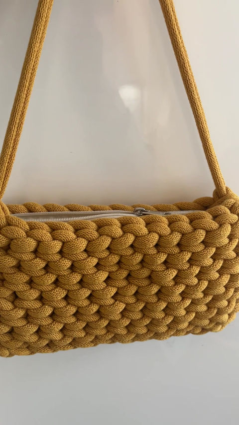 Thumbnail: video of yellow shoulder bag with zipped lining made from chunky knotted cotton cord