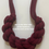 Thumbnail: image of other side of chunky braided necklace with text overlay saying 'it can be worn either way'